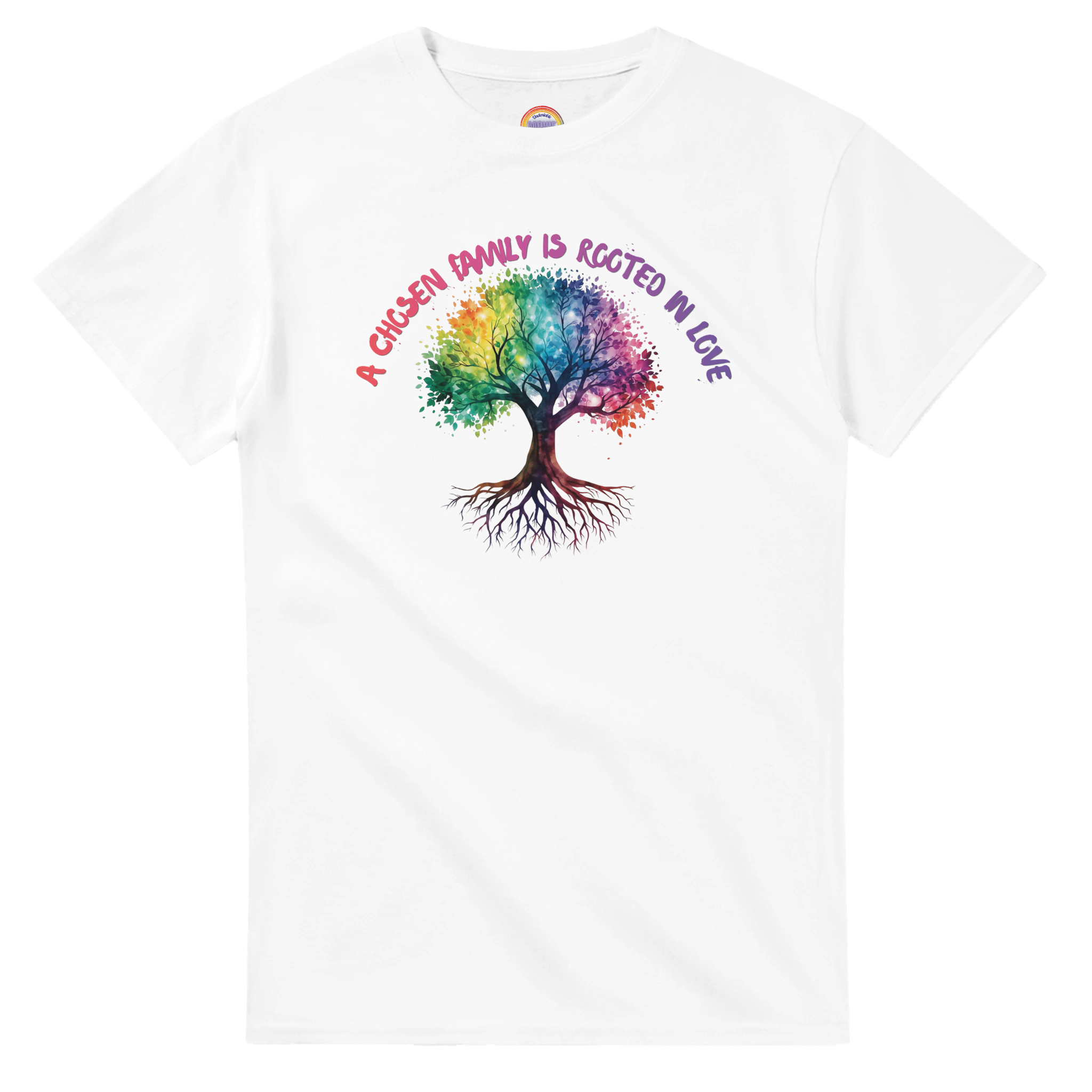 A white t-shirt featuring a colorful graphic of a tree with a rainbow-colored canopy and roots, with the text 'A Chosen Family is Rooted in Love' arched above it in pink and purple lettering.