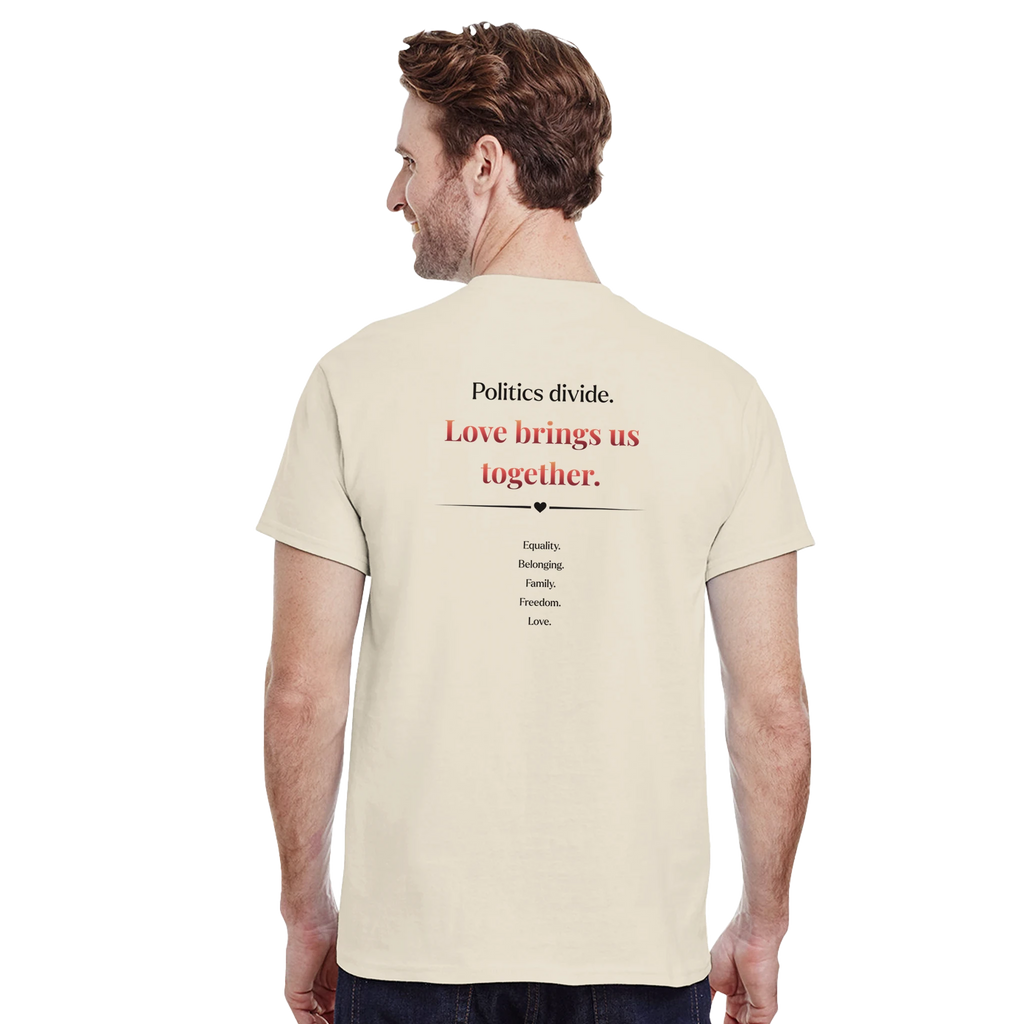 A model showing the back of a natural beige crewneck tee featuring a printed  slogan in black and red text, "Politics Divide. Love brings us together, followed by a list Equality, Belonging, Family, Freedom. 