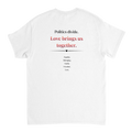 The back of a white tee featuring a printed slogan in black and red text, "Politics divide.  Love brings us together, followed by a list: Equality, Belonging, Family, Freedom