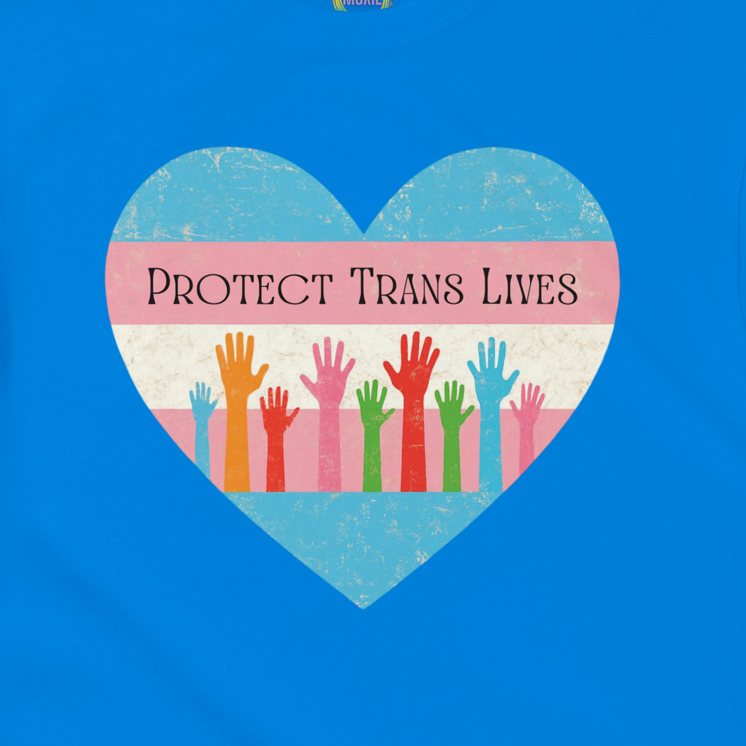 A graphic print on a royal blue garment featuring a distressed heart design with the text 'PROTECT TRANS LIVES' and colorful raised hands in a transgender pride flag color scheme.