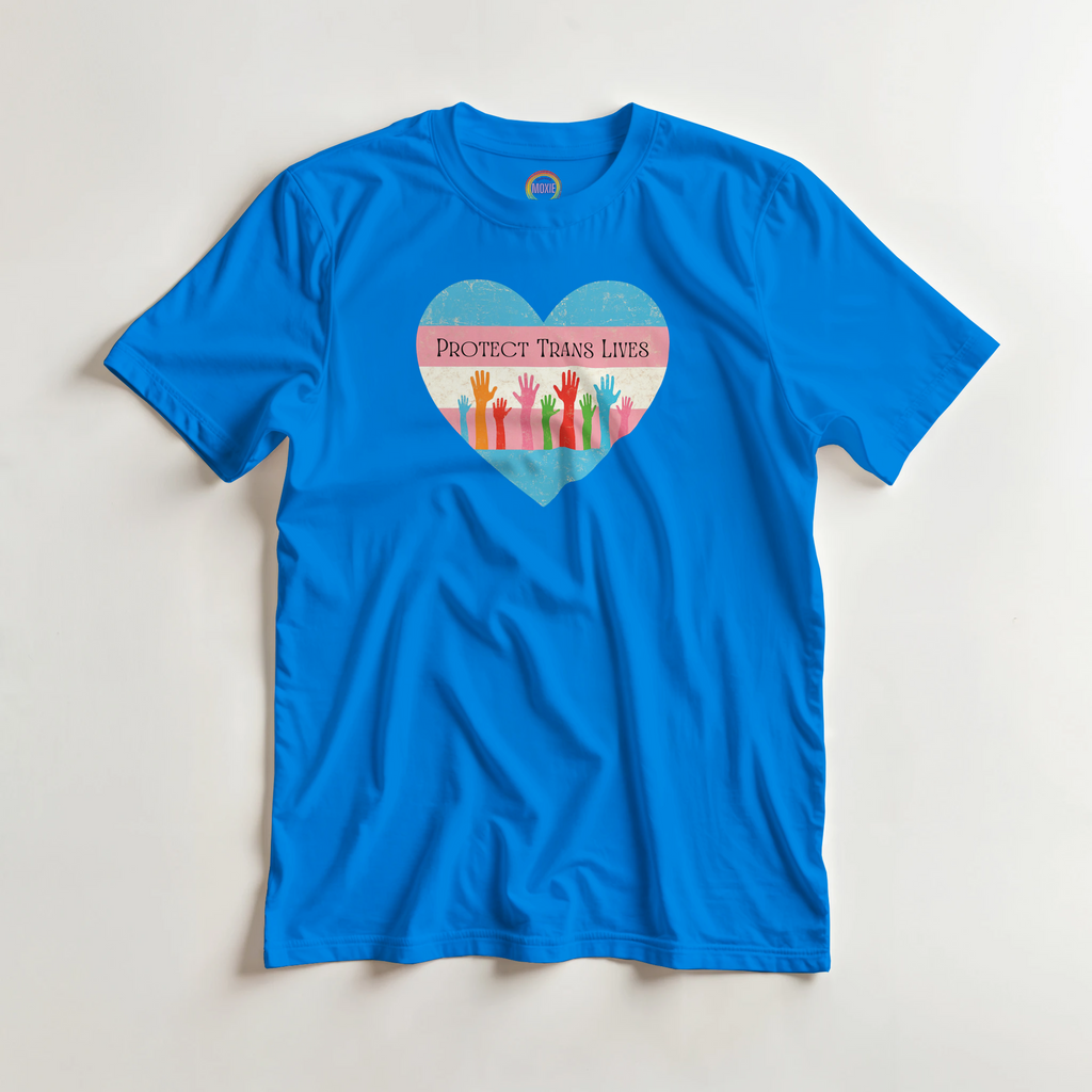 A graphic print on a royal blue garment featuring a distressed heart design with the text 'PROTECT TRANS LIVES' and colorful raised hands in a transgender pride flag color scheme.