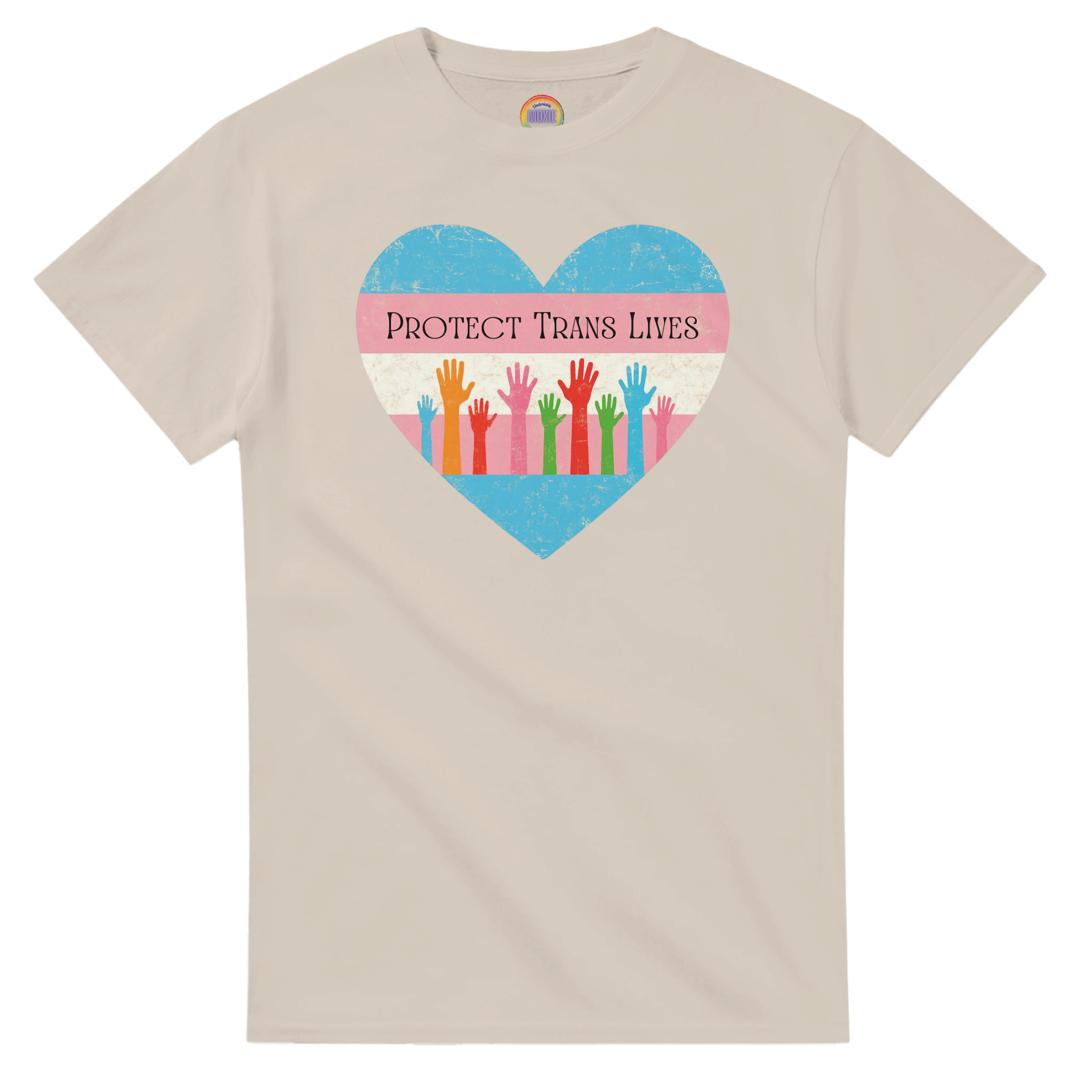 A graphic print on a sand colored tee featuring a distressed heart design with the text 'PROTECT TRANS LIVES' and colorful raised hands in a transgender pride flag color scheme.