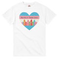 A graphic print on a white tee featuring a distressed heart design with the text 'PROTECT TRANS LIVES' and colorful raised hands in a transgender pride flag color scheme.