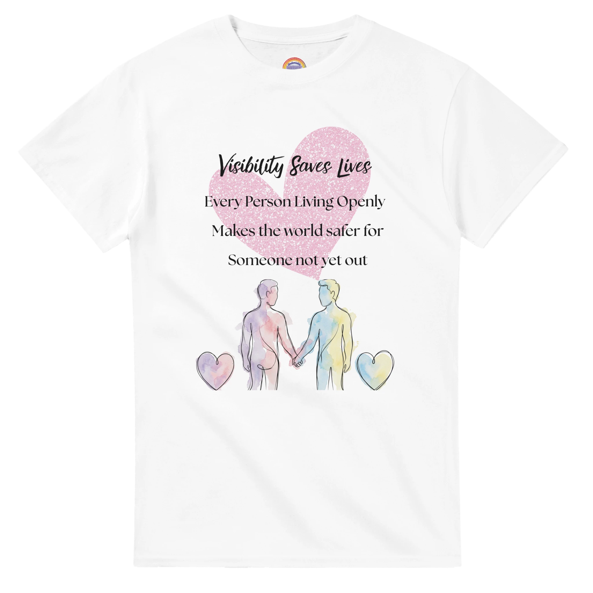 A white short-sleeve crewneck t-shirt featuring a watercolor-style graphic of two male presenting figures holding hands, surrounded by pink and yellow hearts, with the text 'Visibility Saves lives' and 'Every Person Living Openly Makes the world safer for Someone not yet out'.