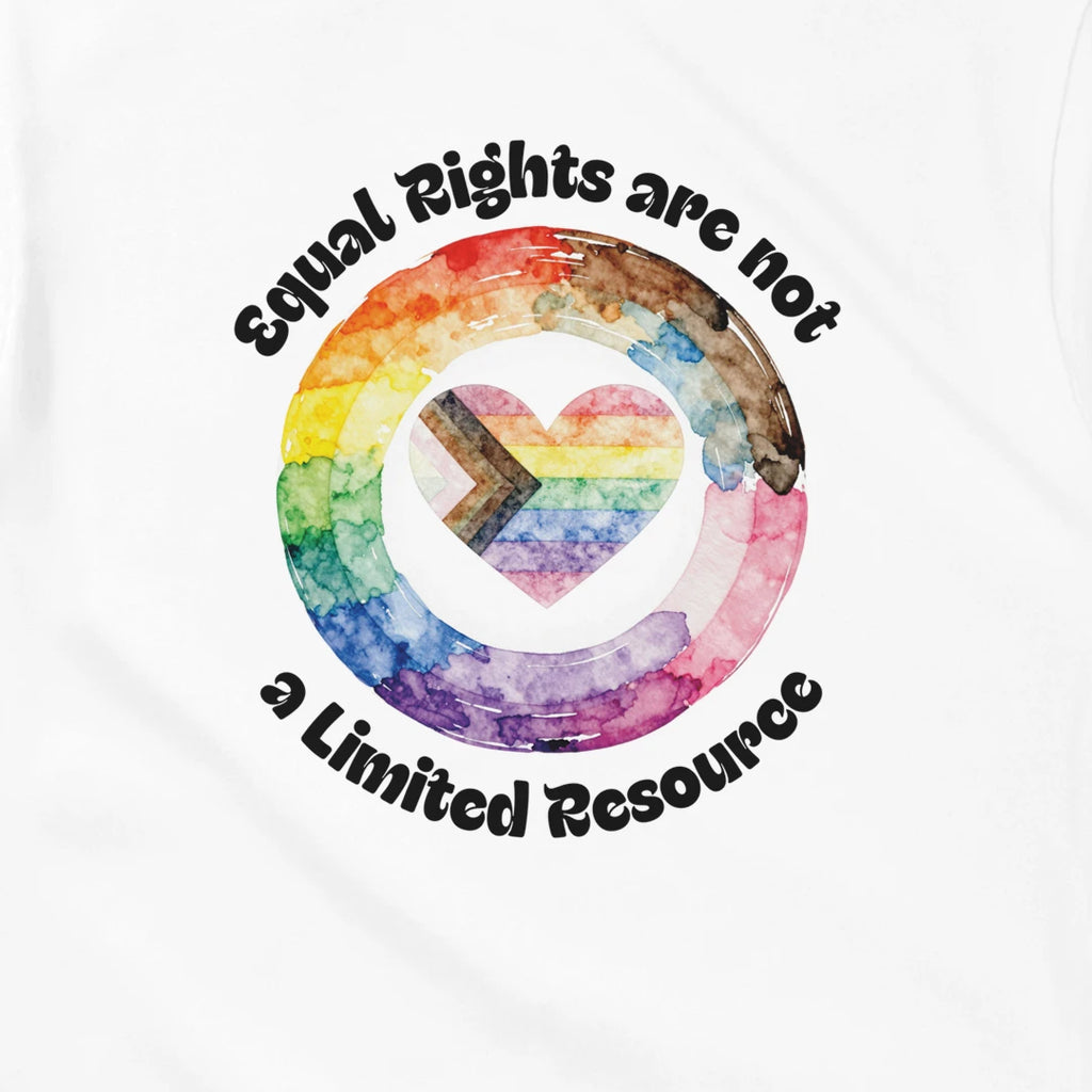 A white t-shirt that states, "Equal Rights are not a Limited Resource". There is a watercolor styled image in the center with a circle and a heart in Progress Pride colors.